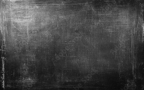 Black and white grunge. Chalk rubbed out on blackboard