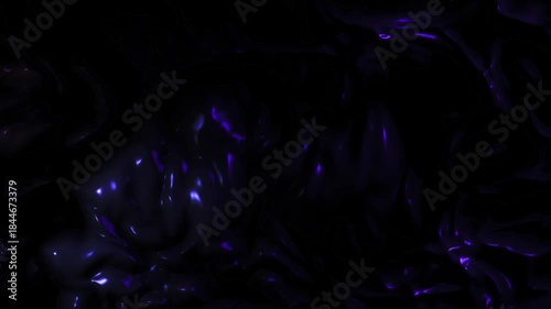 Dark abstract animation featuring subtle violet and blue glowing energy particles drifting across a black background, creating a mysterious and cinematic atmosphere.