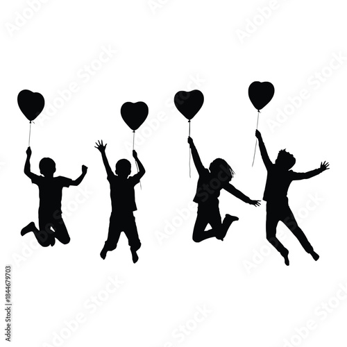 Joyful silhouettes of children jumping and reaching for heart shaped balloons