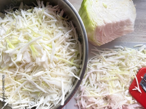 The process of salting white cabbage. shredded white cabbage, sauerkraut, fermented vegetables