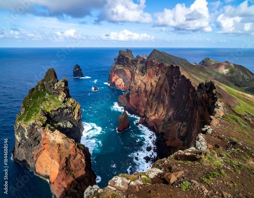 Vivid coastal view showing rugged cliffs, deep blue ocean, and dramatic sky