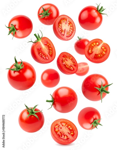 Vivid collection of ripe, round, red fruits and halves on white backdrop