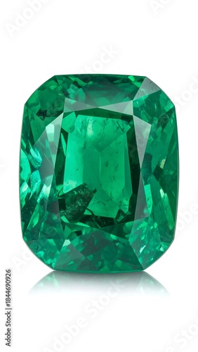 Vivid emerald gemstone, cushion-cut with facets, isolated on white background