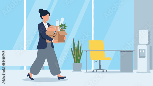 Businesswoman carrying a box of personal belongings in an office