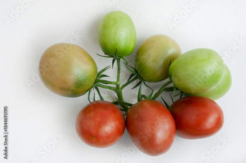 Delicious red tomatoes, isolated on white background