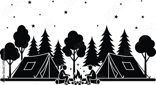 Silhouette of campers around a campfire in a forest