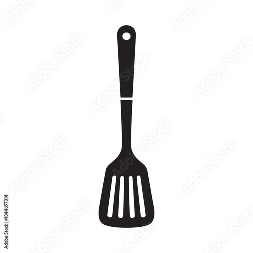 A simple black and white illustration depicting a kitchen utensil specifically a slotted spatula hangs vertically against a white background