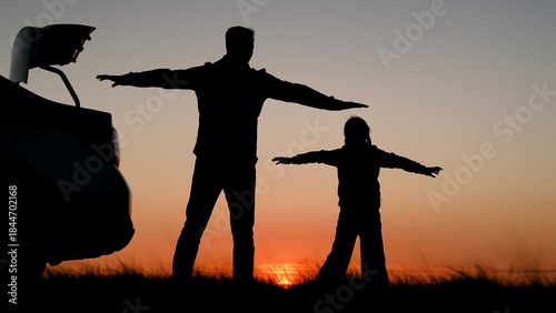 Photos Father child daughter travel by car, admiring beautiful sky sunset