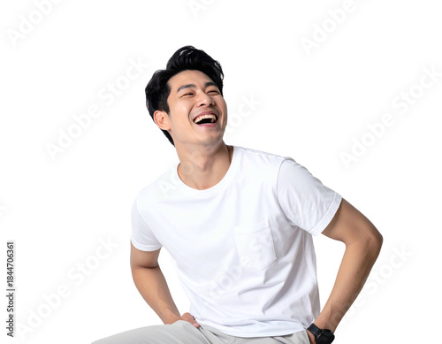 Young man laughs heartily, looking up