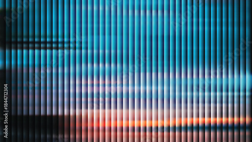 Blurry view of sunset through vertical blinds