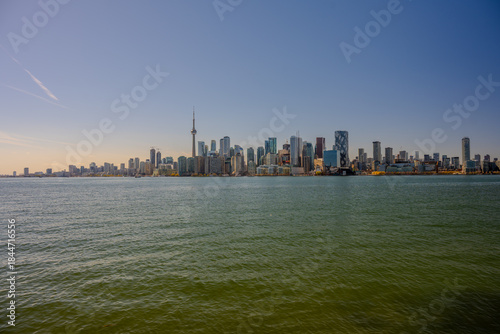 Fotografi Modern skyline with CN Tower across the water in Toronto