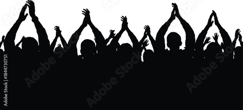 Silhouette of a group of people with raised arms in celebration