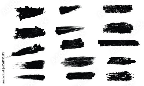 Collection of black brush strokes and smudges on white background