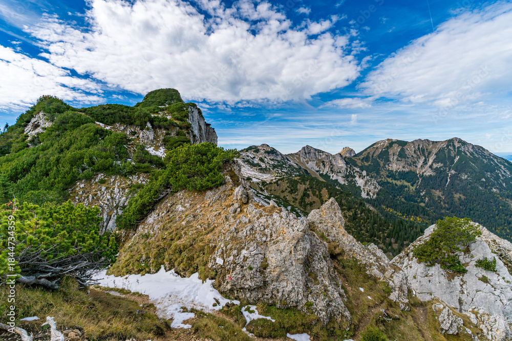 Obraz premium Majestic Tannheimer Valley Autumn Hike Reveals Dramatic Alpine Peaks and Serene Forests