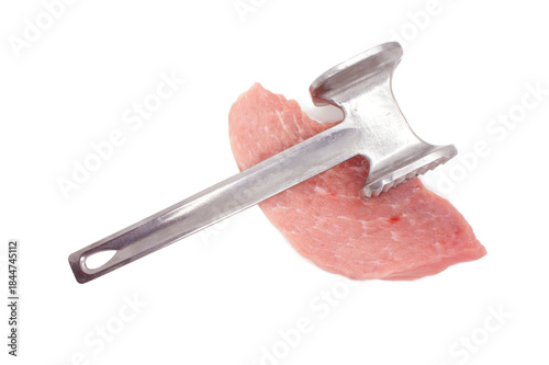 Metal meat hummer and Pork Chop isolated on white background. Cooking Pork meat. Piece of pork loin for chipping. Close-up. 
