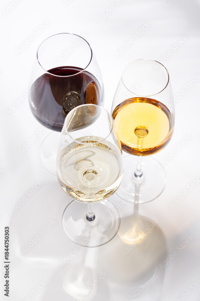 Obraz premium Different wine glasses on white background