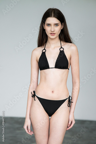 Natural emotional portrait of young woman model with expressive face, authentic beauty, lifestyle mood, clean skin, real emotions, modern female portrait photography in studio