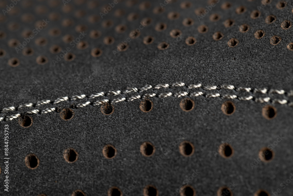 Naklejka premium smooth perforated leather for shoe production , a large number of equal holes in natural leather for shoe production