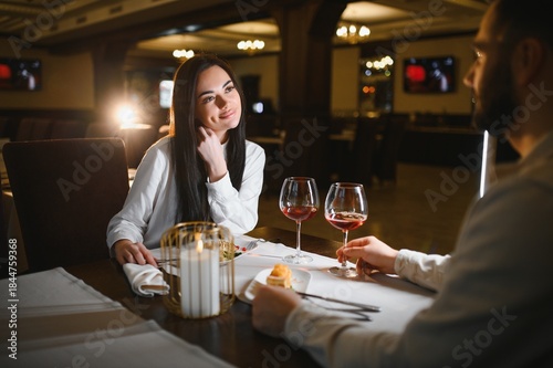 Quadro em tela Happy couple enjoying romantic candlelit dinner together