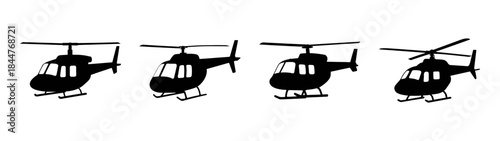 A collection of four black silhouettes depicting helicopters in a uniform row