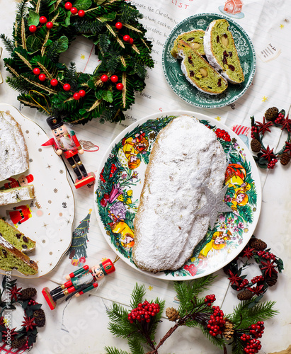 Traditional Christmas Stollen with matcha tea on a Christmas rustic background