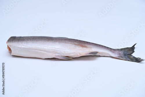wild raw salmon gutted for cooking on white background