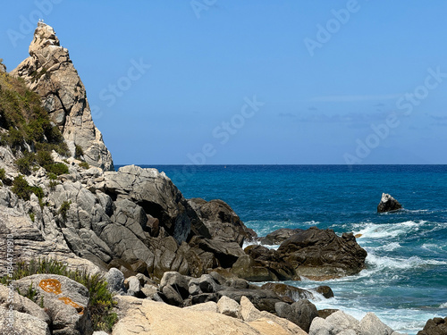 Calabria, Italy, beach and surf among rocks, Mediterranean