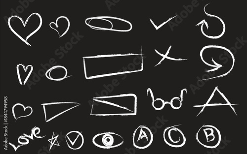 Collection of hand drawn symbols and shapes on blackboard