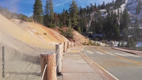 This scenic view captures the steam vents and boiling mud pots of the Sulphur Works hydrothermal area at Lassen Volcanic National Park