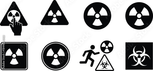 Radioactive warning signs and biohazard symbols in black silhouette on transparent background