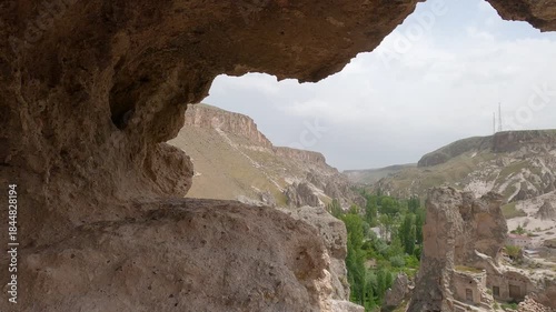Cappadocia cave houses seen from rock dwelling window in Soganli valley, Turkey