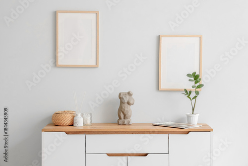Chest of drawers with statu...