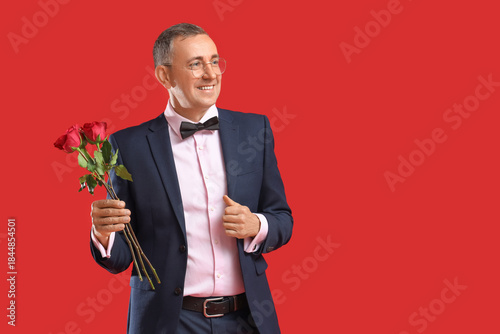 Happy mature man with rose ...