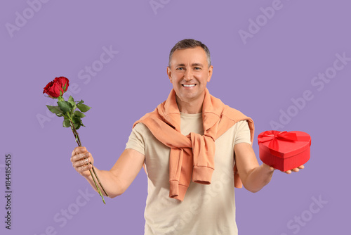 Happy mature man with rose ...
