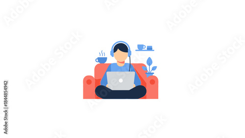 Young man wearing headphones working on a laptop while sitting on a couch.