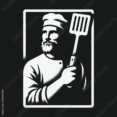 Professional Bearded Chef Holding a Spatula in a Frame.
