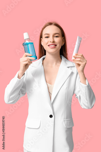 Young woman with mouth rins...