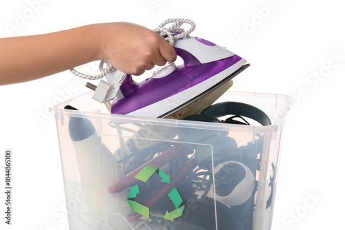 Woman putting iron in recyc...