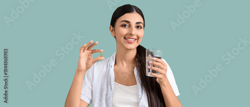 Young woman with vitamin E ...