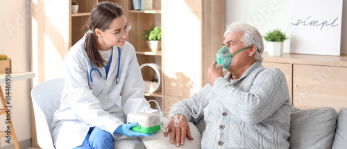Photos Senior man with nebulizer and nurse at home