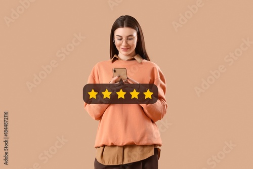 Beautiful young woman using...