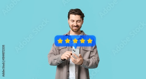 Tableau sur toile Man with mobile phone giving feedback on blue background