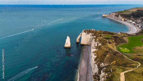 Aerial drone view of picturesque coastal limestone cliffs and the English Channel town of Etretat, France