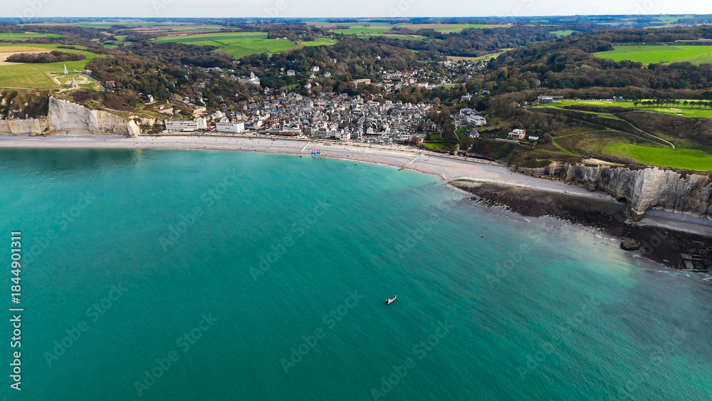 Fototapeta premium Aerial drone view of picturesque coastal limestone cliffs and the English Channel town of Etretat, France