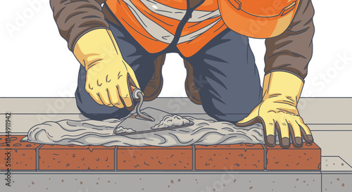 A skilled construction worker meticulously applies fresh mortar with a trowel, carefully laying bricks to build a sturdy wall or foundation.