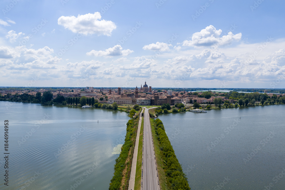 Obraz premium Aerial view of Mantua skyline and causeway across Lago di Mezzo - Mantua, Italy