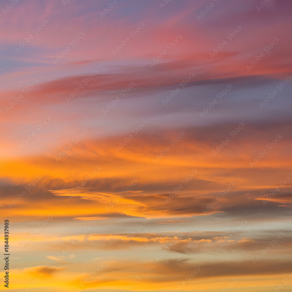 Fototapeta premium Vibrant sunset sky with colorful clouds