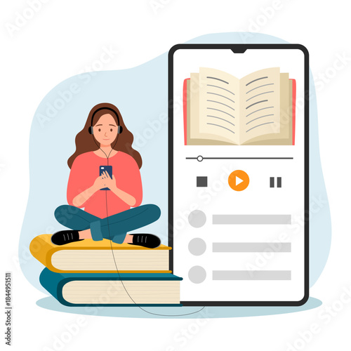 Woman with headphones sits cross-legged on books, holding smartphone playing an audiobook.