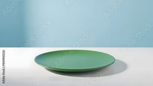 Empty Green Plate on Minimal Blue Background