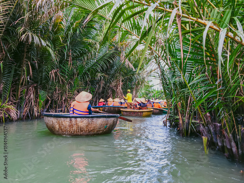 Tourists riding bamboo basket boats in Hoi An, vietnam (Cam Thanh water coconut village )